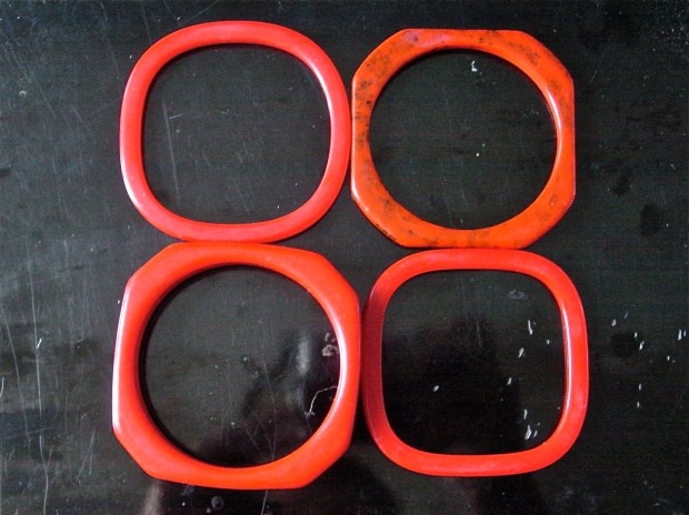 Red bakelite and celluloid bangles