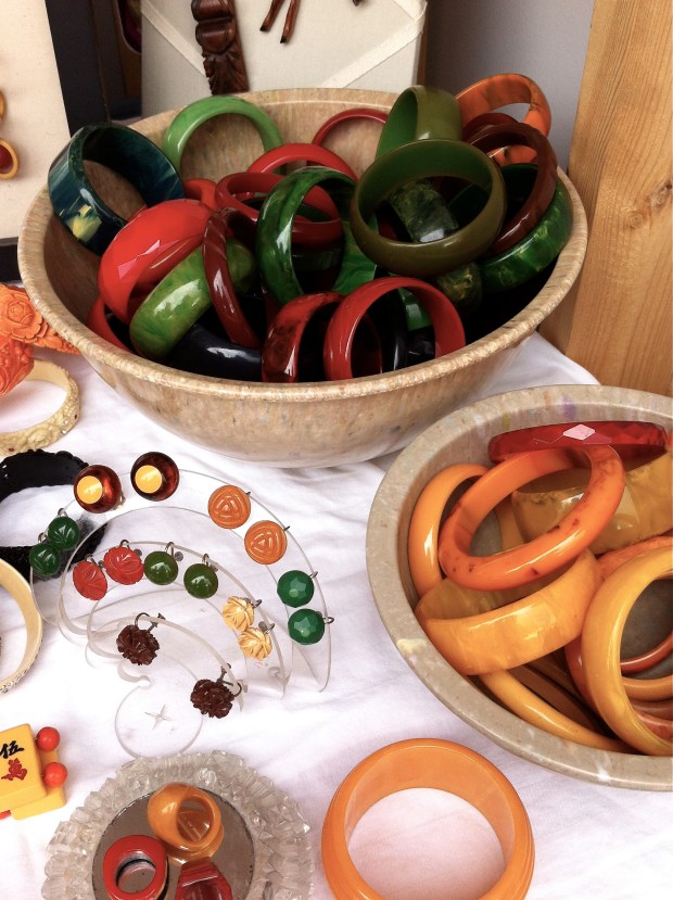 Display of Bakelite jewelry Texas Ware bowl filled with Bakelite jewelry
