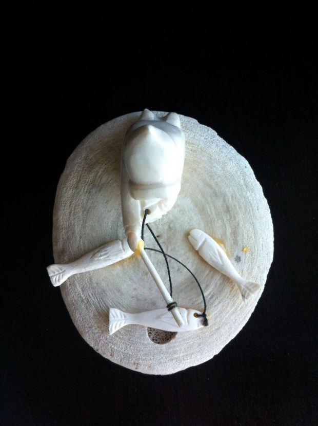 Inuit whale bone carving of a fisherman